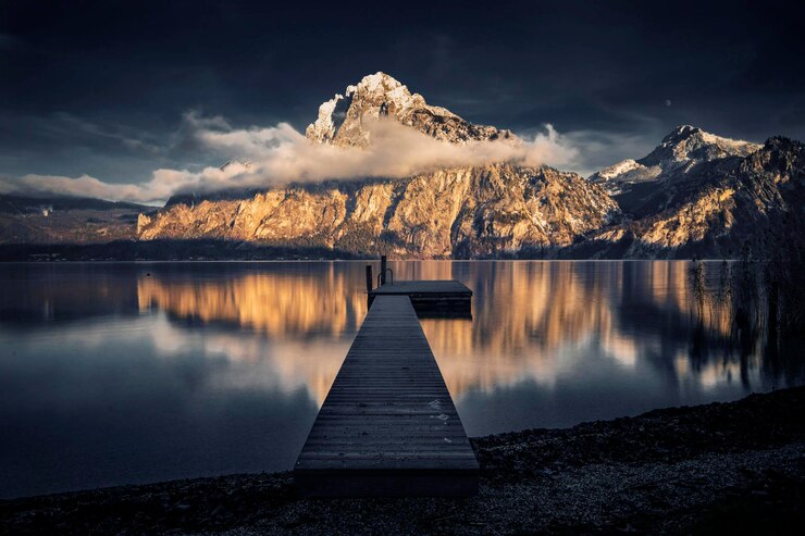 Photo scenic view of lake by mountains against sky