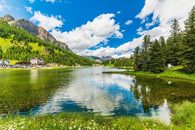 Scenic view of lake by trees against sky