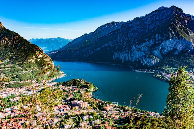 Scenic view of lake and mountains against blue sky