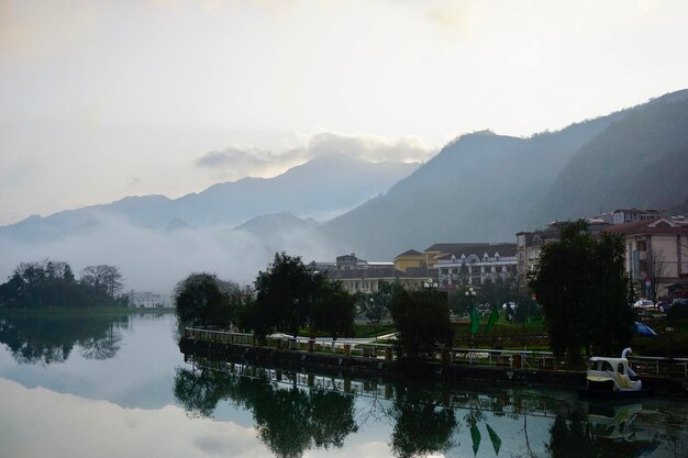 Scenic view of lake and mountains against sky