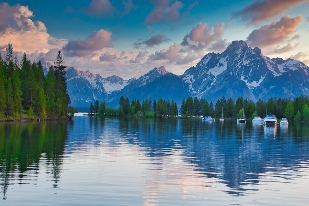 Scenic view of lake and mountains against sky