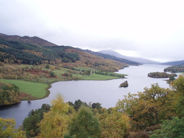 Scenic view of lake and mountains against sky