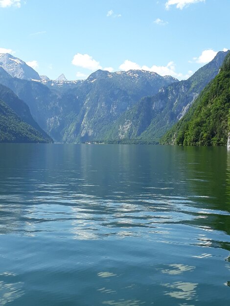 Scenic view of lake and mountains against sky