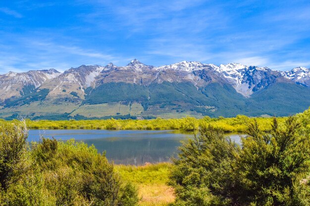 Scenic view of lake and mountains against sky