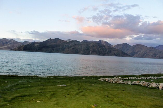 Scenic view of lake and mountains against sky