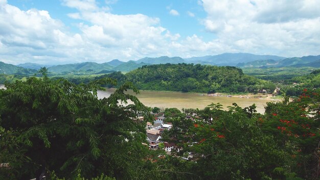 Scenic view of lake and mountains against sky