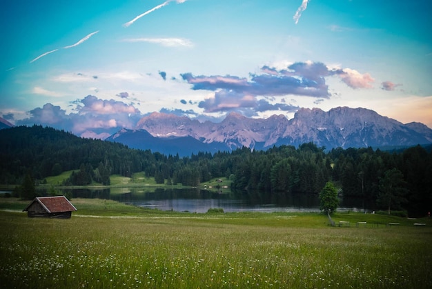 scenic view of lake and mountains against sky