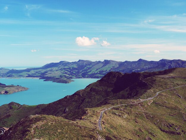 Scenic view of lake and mountains against sky