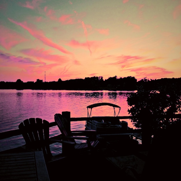 Scenic view of lake at sunset