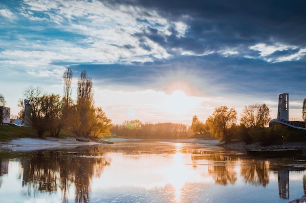 scenic view of lake at sunset