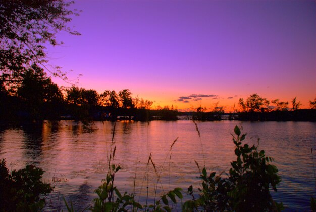 Scenic view of lake at sunset