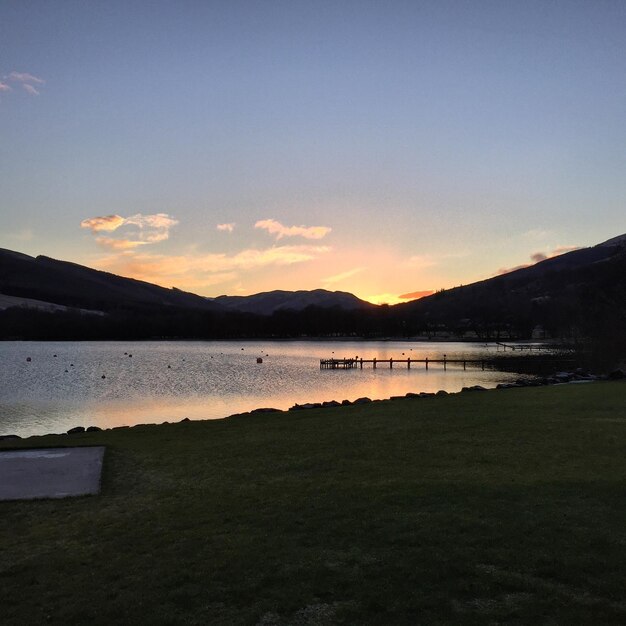 Scenic view of lake at sunset