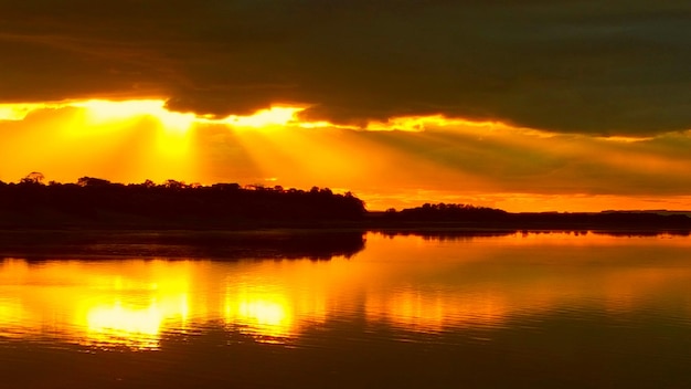 Scenic view of lake at sunset