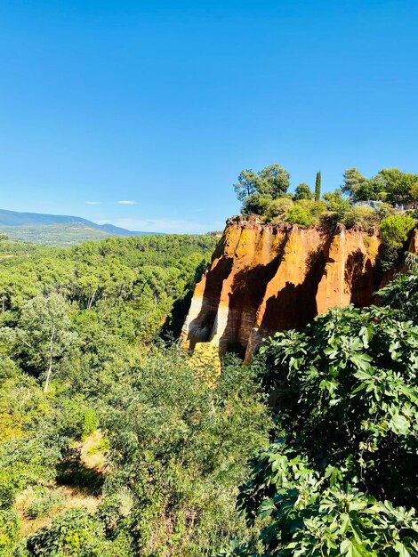 Scenic view of land against clear blue sky