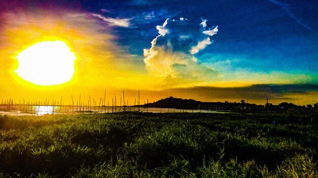 Scenic view of land against sky during sunset