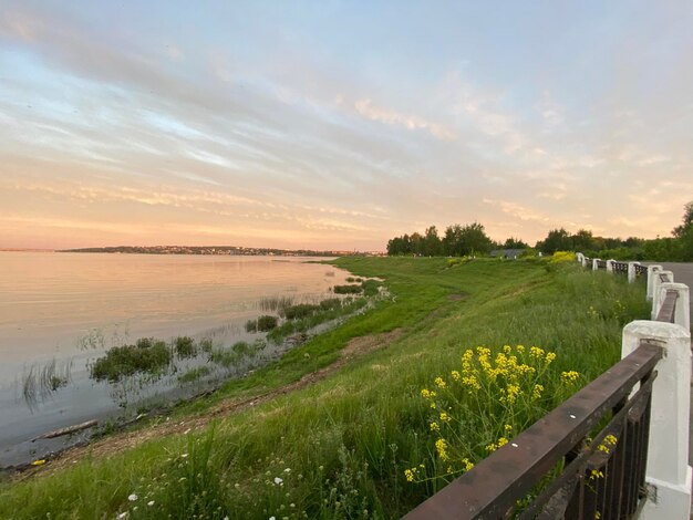 Scenic view of land against sky during sunset