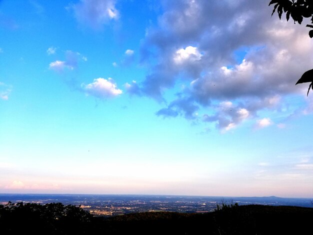 Scenic view of landscape against blue sky