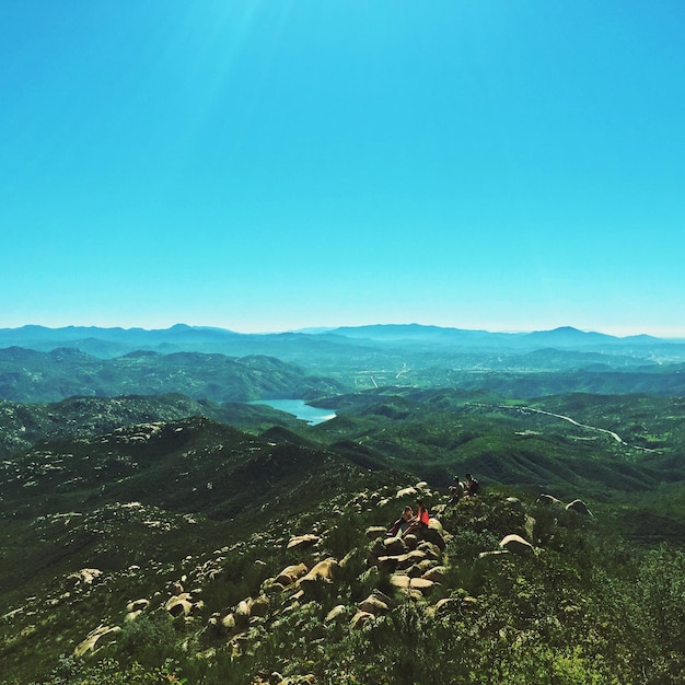 Scenic view of landscape against blue sky