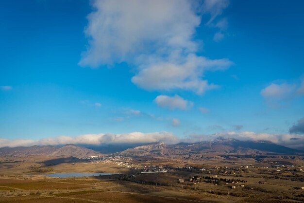 Scenic view of landscape against blue sky