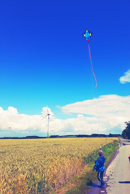 Scenic view of landscape against blue sky