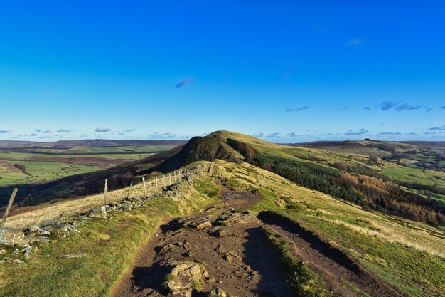 Scenic view of landscape against blue sky