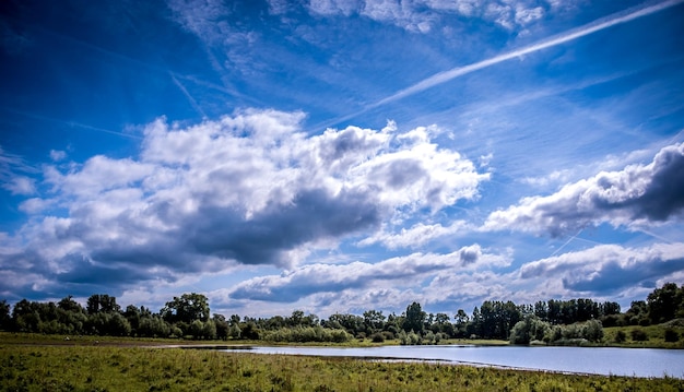 scenic view of landscape against blue sky