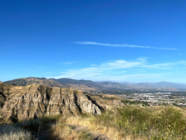 Scenic view of landscape against blue sky