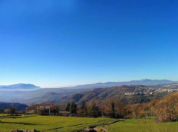 Photo scenic view of landscape against clear blue sky