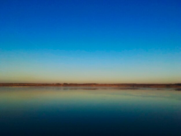 Scenic view of landscape against clear blue sky