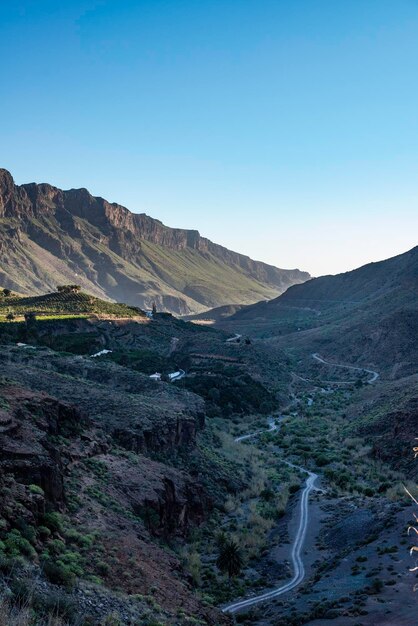 Scenic view of landscape against clear blue sky