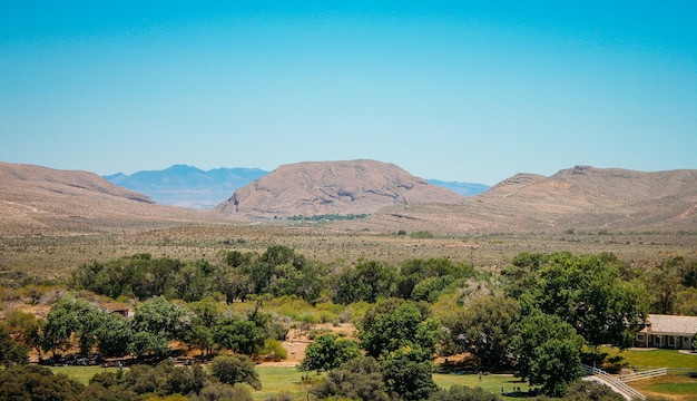 scenic view of landscape against clear blue sky