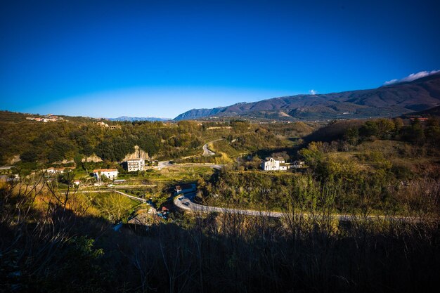 Scenic view of landscape against clear blue sky