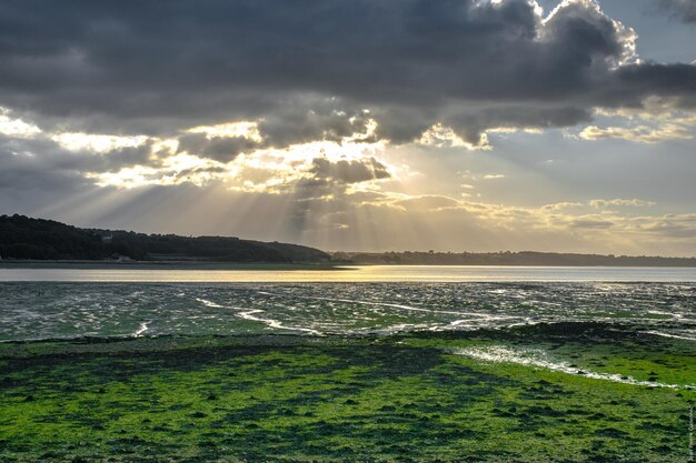 Scenic view of landscape against cloudy sky