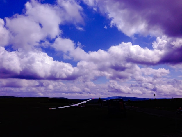 Scenic view of landscape against cloudy sky