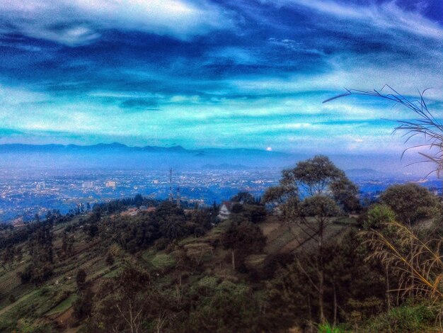 Scenic view of landscape against cloudy sky