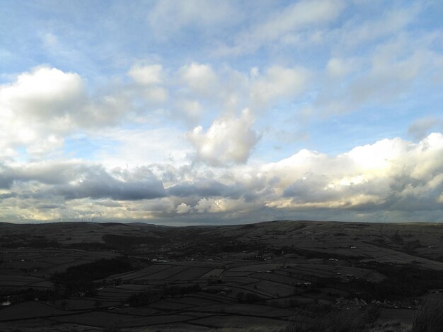 Scenic view of landscape against cloudy sky