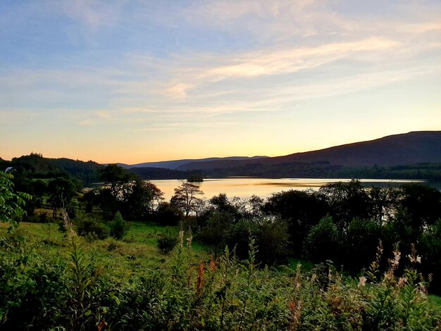 Scenic view of landscape against sky during sunset