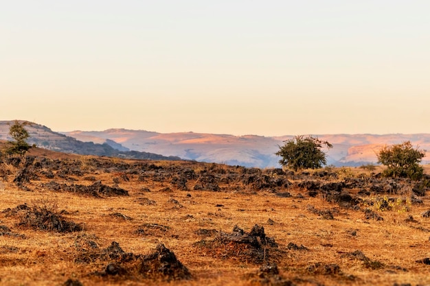 Photo scenic view of landscape against sky during sunset