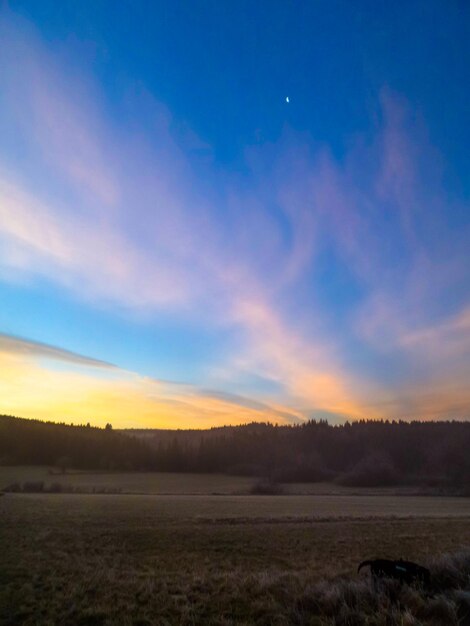 Scenic view of landscape against sky during sunset