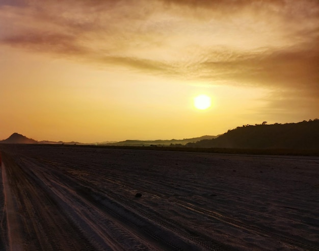 Scenic view of landscape against sky during sunset