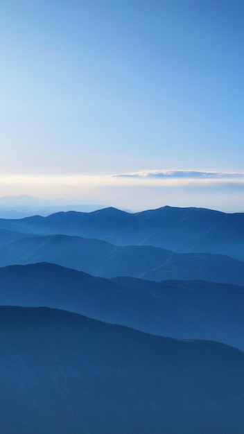 Photo scenic view of landscape against sky during sunset