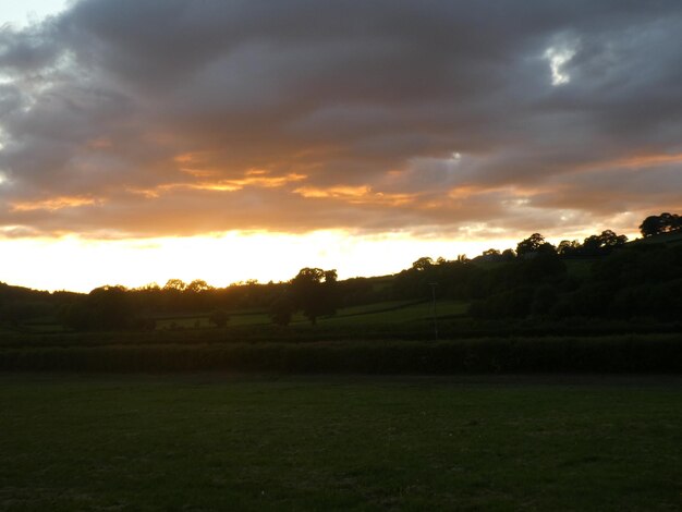 Scenic view of landscape against sky during sunset