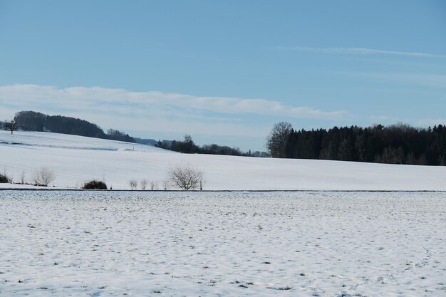 Scenic view of landscape against sky during winter