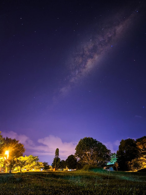 Scenic view of landscape against sky at night
