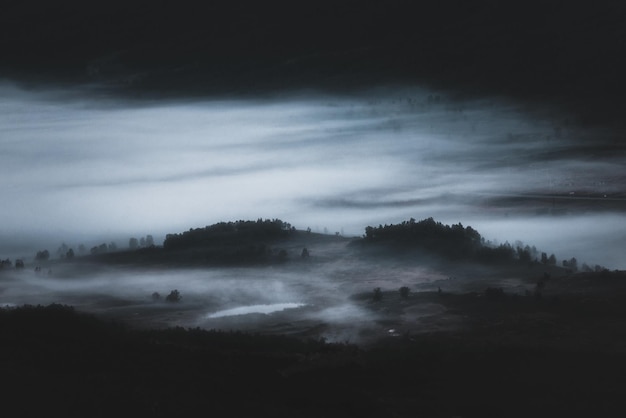 Scenic view of landscape against sky at night