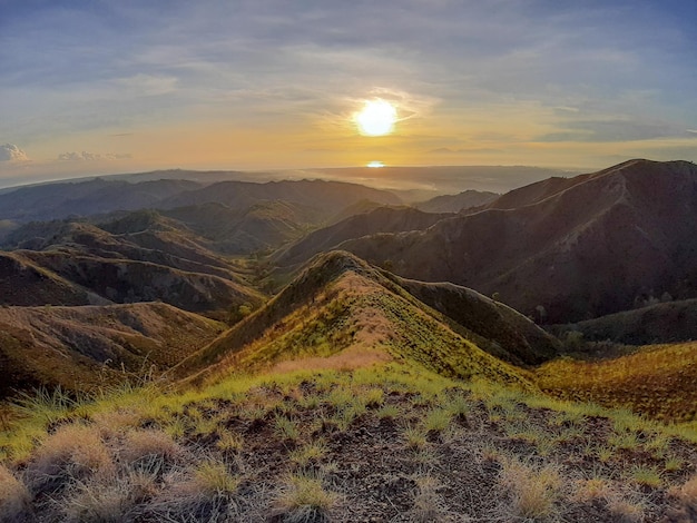 Scenic view of landscape against sky during sunset