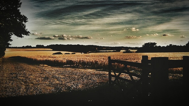 Photo scenic view of landscape against sky at sunset