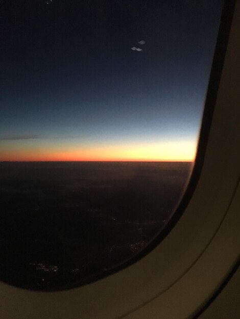 Scenic view of landscape against sky at sunset