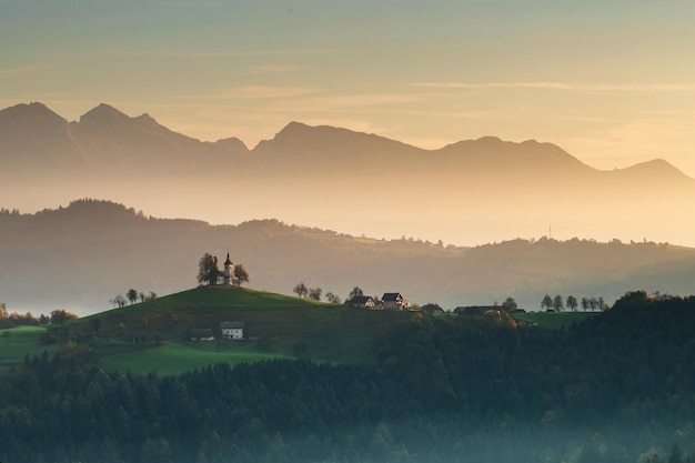 Scenic view of landscape and mountains against sky during sunset