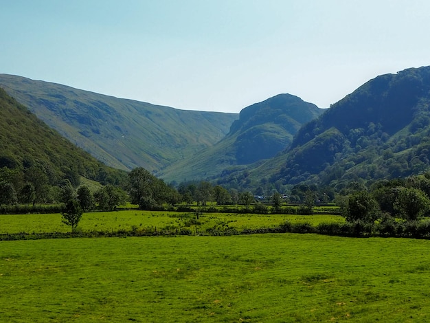 Scenic view of landscape and mountains against sky